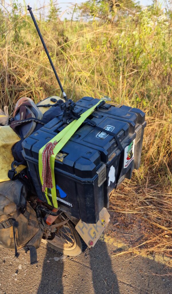 Straps holding the top box in place.